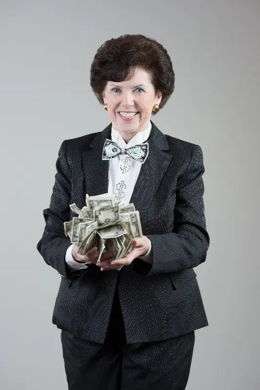 A woman in a suit holding money