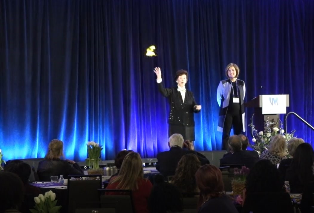 A man and woman are performing on stage.